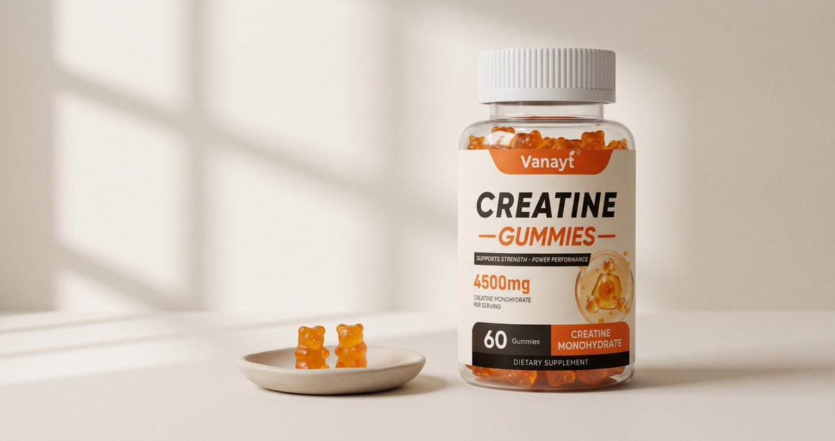 Bottle of Vanayt creatine gummies beside two orange gummies